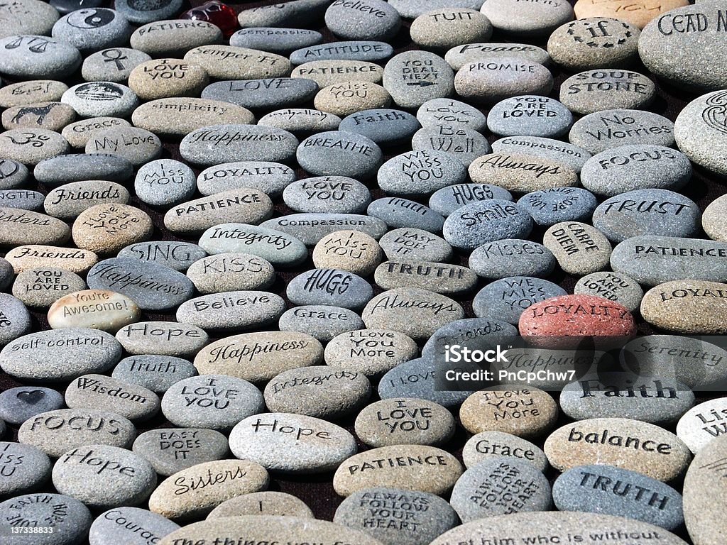 Wisdom Stones A shot of stones carved with words of wisdom Single Word Stock Photo