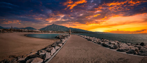 panorama of marbella from puerto banus at sunrise, andalusia, spain - puerto de sol imagens e fotografias de stock