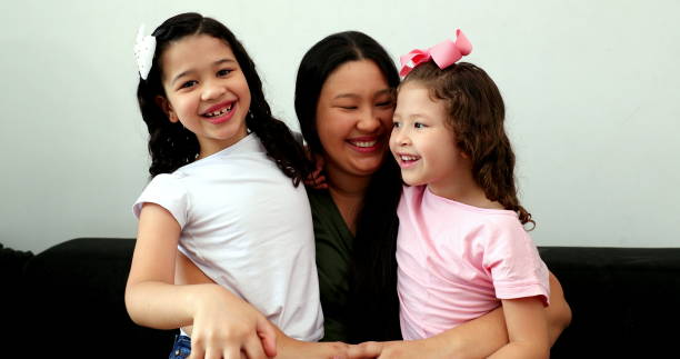 istock Mother and children waving goodbye with hands 1373396150