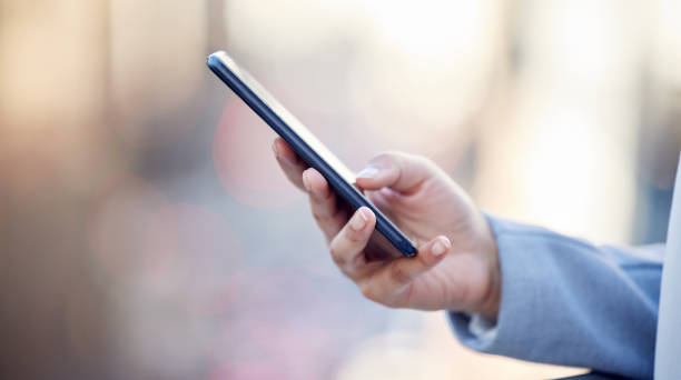 istock Cropped shot of an unrecognizable businessman using his cellphone outside 1373403192