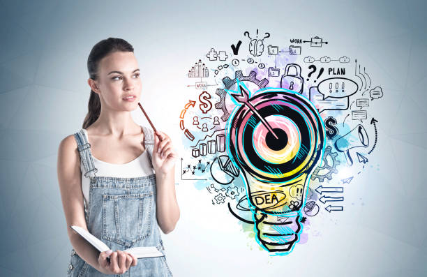 istock Woman with pencil and idea sketch 1373410039