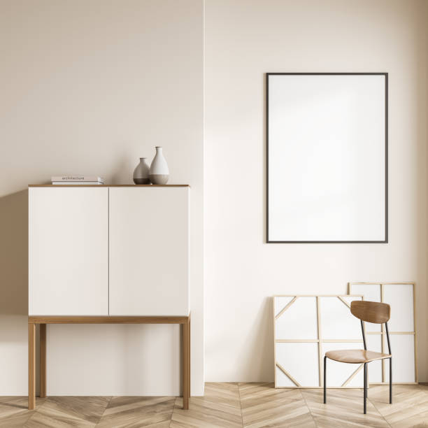 istock Bright living room interior with empty white poster, chair, cupboard 1373424747