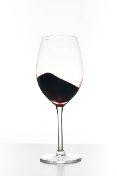 istock Glass of red wine isolated on white 1373425468