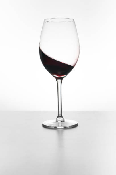 istock Glass of red wine isolated on white 1373425514