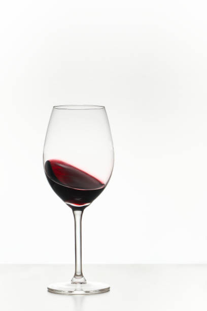 istock Glass of red wine isolated on white 1373425831