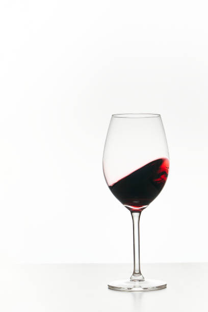 istock Glass of red wine isolated on white 1373425838