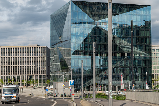 the modern and architectural Cube Berlin office building at Berlin Central Station from the street in portrait format
