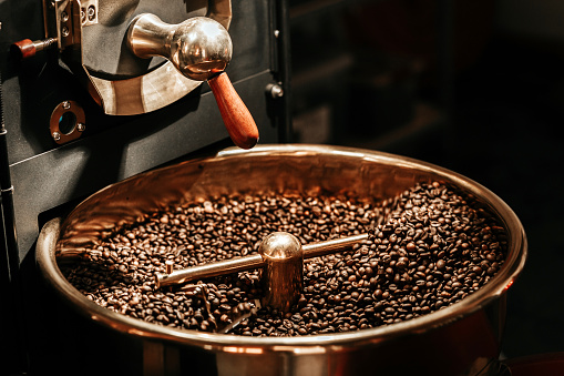 Coffee beans being cooled after being roasted from a coffee roaster machine