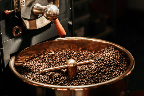Coffee beans being cooled after being roasted from a coffee roaster machine stock photo
