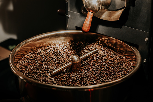 Coffee beans being cooled after being roasted from a coffee roaster machine