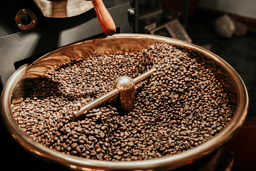 Coffee beans being cooled after being roasted from a coffee roaster machine