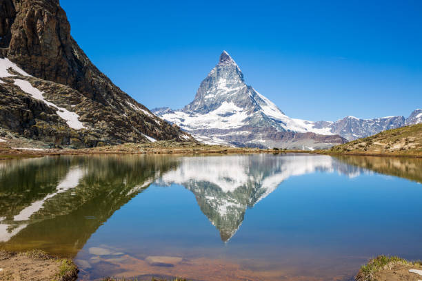 istock Matterhorn Reflection on Lake Rifflesee, Zermatt Switzerland 1373431084