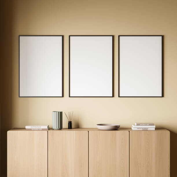 istock Three empty canvases with living room sideboard on yellow background 1373439901