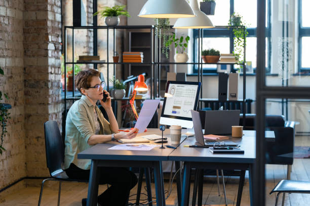 istock Businesswoman working at office at her workplace 1373441000
