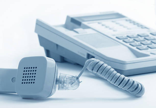Telephone Phone receiver in the office keyborad stock pictures, royalty-free photos & images
