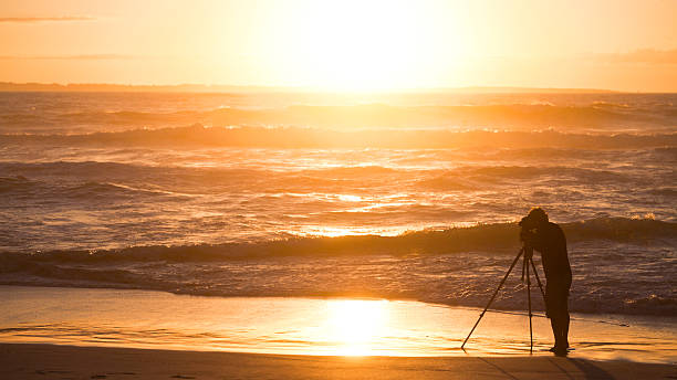 istock Sunset silhouetted photographer 137344798