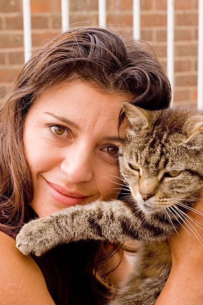 istock Pretty woman with tabby cat 137344887