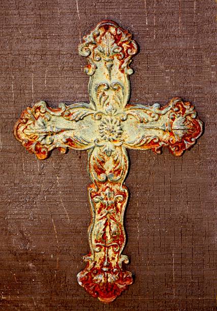 istock Grungy Rusty Cross on Wood 137345224