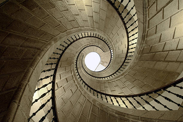 угол подъема винтовой линии - directly below low angle view stone staircase стоковые фото и изображения