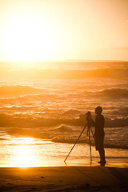 istock Sunset silhouetted photographer 137345500