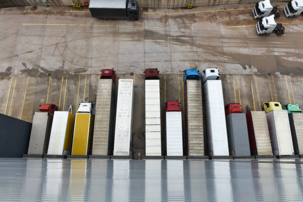 istock Semi Trucks at Warehouse, Aerial View 1373463415