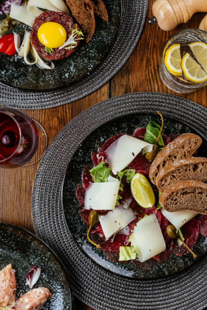 istock marble beef carpaccio with herbs, rye bread and sauce 1373464518