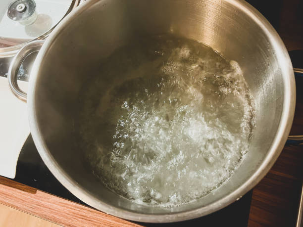 istock Boiling water in a large iron pot. 1373464956
