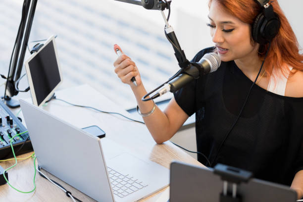 istock High angle view female podcaster recording show in studio 1373466129