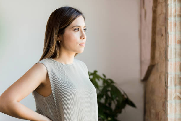 istock Serious business manager stands with hands on hips 1373476280