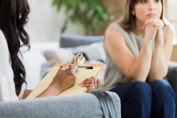 istock Unrecognizable female therapist waits as female patient thinks 1373476288