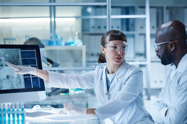 istock Scientists discussing the mutation of virus 1373477879