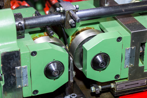 istock Close up roller of continuous horizontal automatic thread rolling machine for steel bar or rod in manufacturing 1373478416