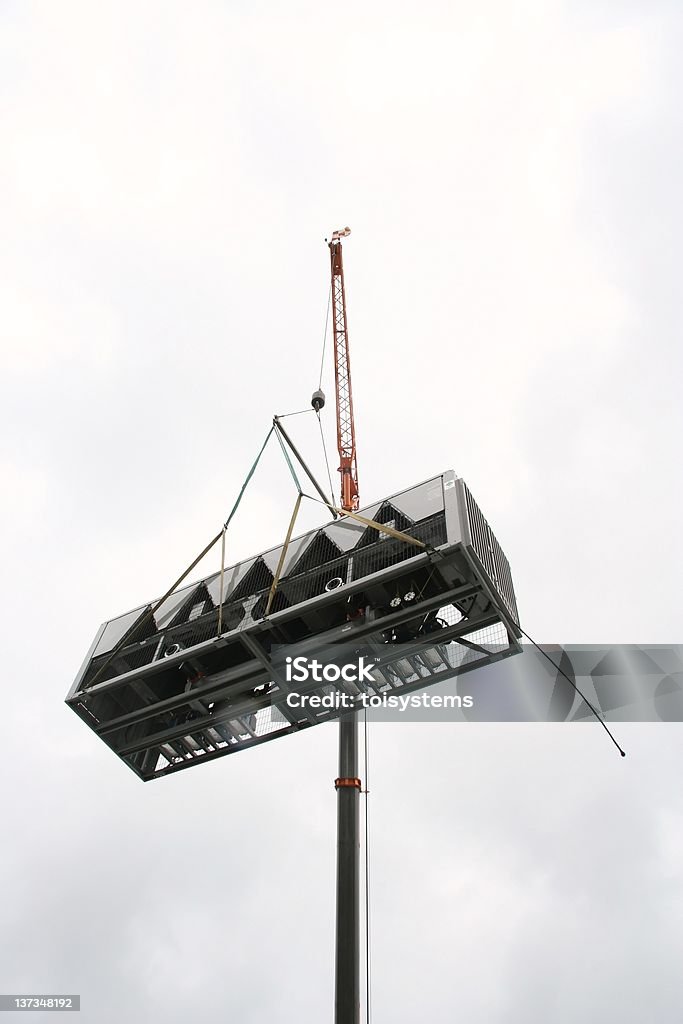 Air Conditioner hoisted by crane AC lifted Air Conditioner Stock Photo