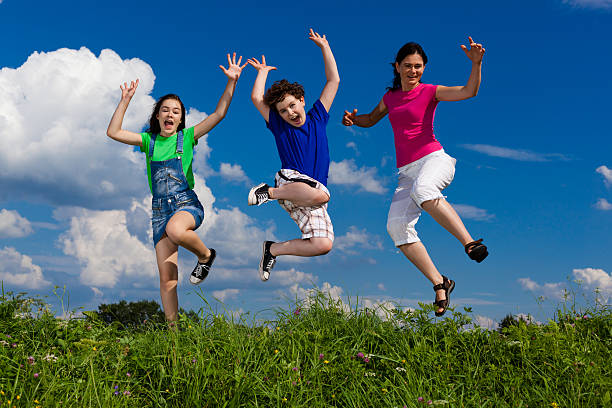 istock Mother with kids jumping outdoor 137350004