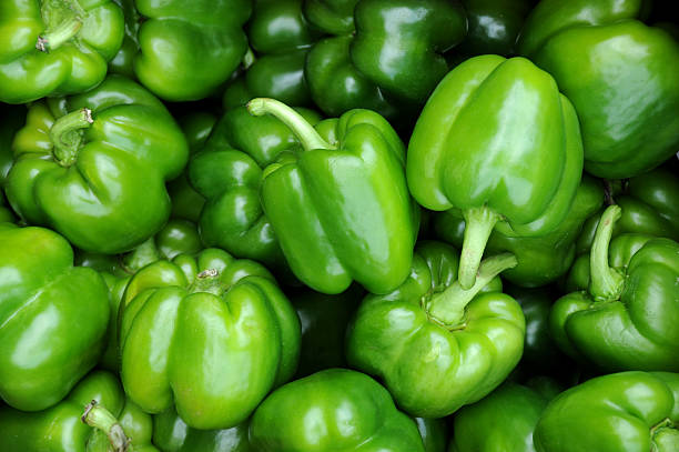 Green Peppers A close-up of a bunch of green peppers bell pepper stock pictures, royalty-free photos & images
