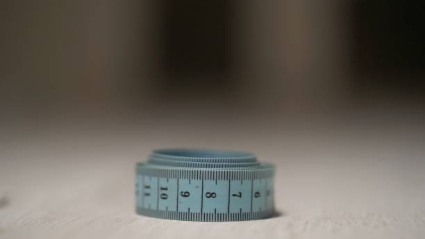 istock Measuring tape. Tailor taking measurements for tailoring 1373502247
