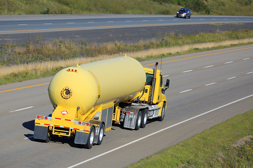 Semi propane tanker truck delivering its load.