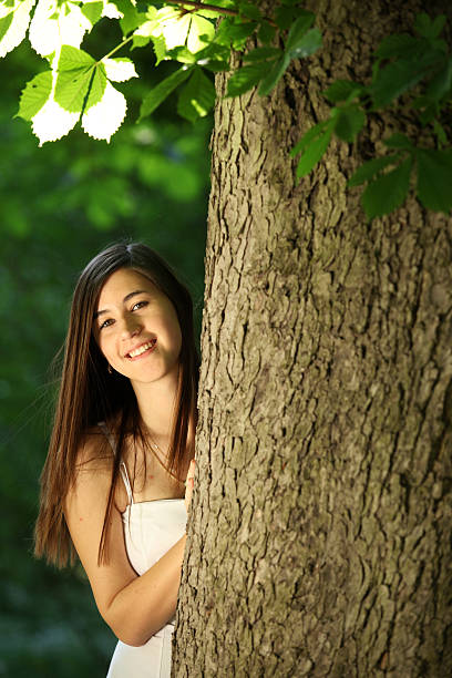 istock Beauty woman behind tree 137352145