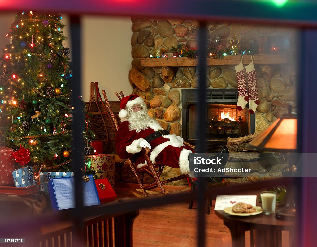 Santa eating cookies Santa takes a break after a long night. Adults Only Stock Photo