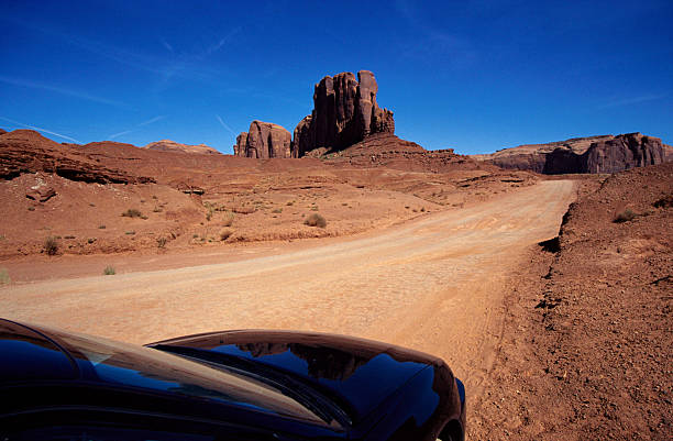 istock Mount of Monument valley and reflections on black car 137353239