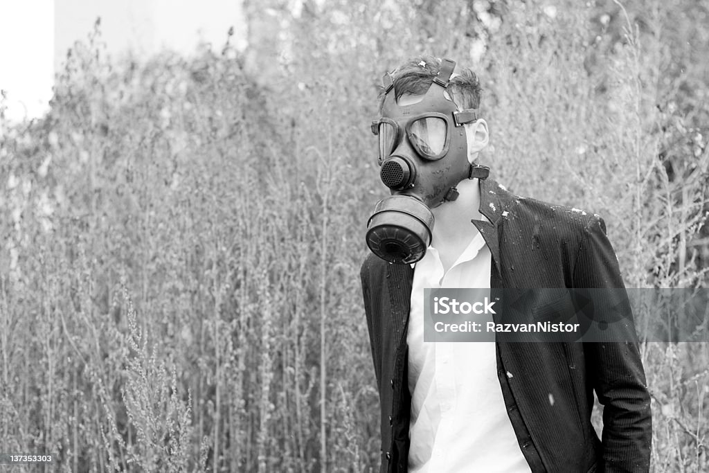 Nuclear Winter Scenario for a nuclear winter. Model wearing gas mask unaware of radiation's. Business Stock Photo