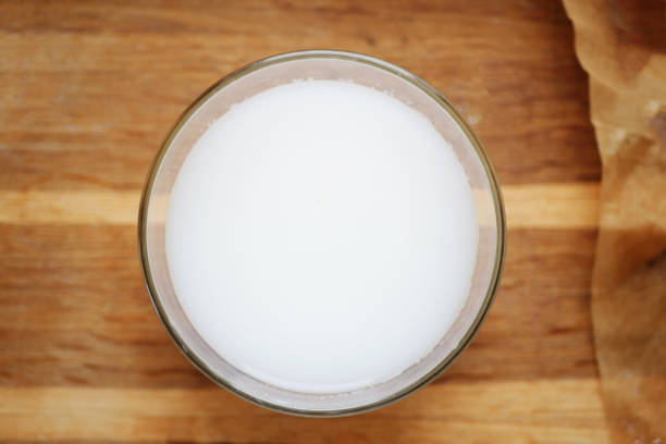 istock Milk in the plate on wooden table 1373540977