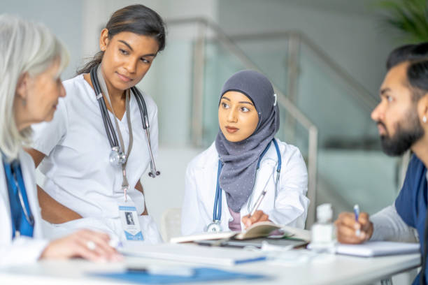 istock Medical Students Meeting with Their Teacher 1373570775