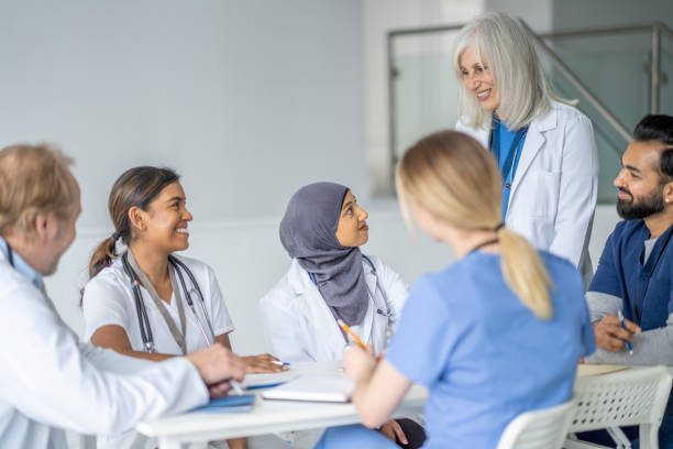istock Senior Doctor Leading a Meeting 1373570778