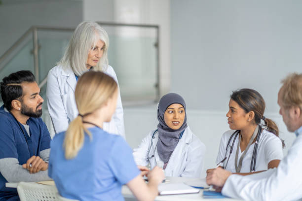 istock Senior Doctor Leading a Meeting 1373570781