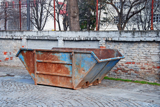 istock Old rustic industrial metal garbage container  in the backyard 1373580803
