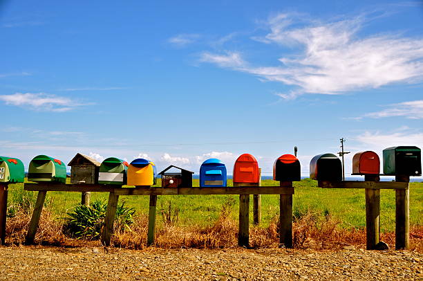Mailboxes - Coromandel Peninsula, NZ Mailboxes before green field and blue sky along the coast on the coromandel peninsula, NZ 2011 coromandel peninsula stock pictures, royalty-free photos & images