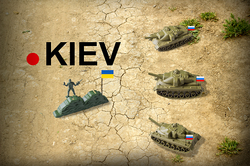 El concepto de la invasión rusa de Ucrania en 2022. Tanques rusos marchan sobre la capital ucraniana, Kiev photo