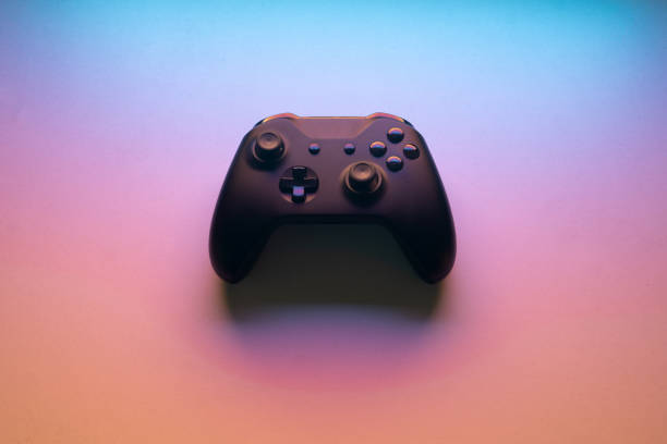 istock wireless joystick gamepad for pc or console isolated on a colorful background. gaming concept. 1373614328
