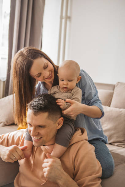 istock Young family at home 1373627553